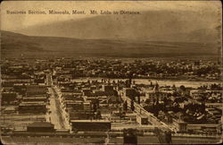 Business Section, Mt. Lolo in Distance Missoula, MT Postcard Postcard