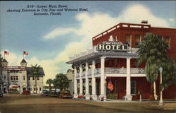 Lower Main Street showing Entrance to City Pier and Watrous Hotel Postcard