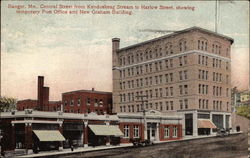 Central Street from Kenduskeag Stream to Harlow Street, showing temporary P.O. and New Graham Bldg Postcard