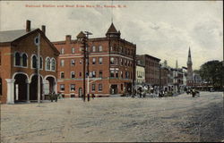 Railroad Station and West Side Main St Postcard