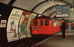 Tube Train entering Piccadilly Circus Station London, England Postcard Postcard