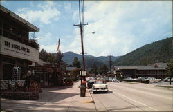 Street Scene Featuring Vintage Vehicles in Gatlinburg Tennessee Postcard Postcard