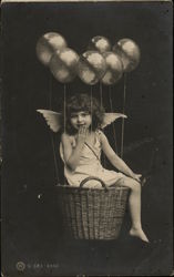 Child Posing in Basket with Wings Children Postcard Postcard