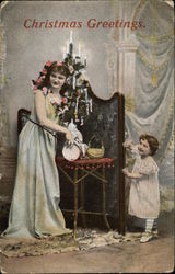 Christmas Greetings with Woman & Child Postcard