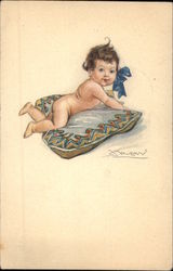 Baby with Blue Bow Lying on Pillow Babies Postcard Postcard