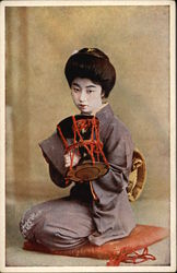 Geisha Girl Kneeling on Pillow Postcard