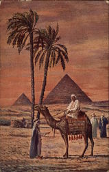 Egyptian Pyramids, Palm Trees, Camel and Men in the Desert Postcard