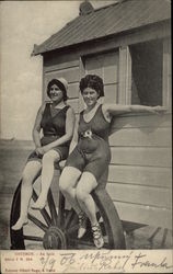 Two Women Sitting On A Wheel Postcard