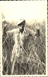 Man in hat in tall field Men Postcard Postcard