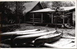 Log Cabin with Four Canoes Canoes & Rowboats Postcard Postcard