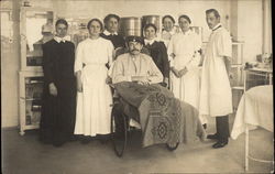 Doctor & Nurses with Man in Wheelchair Postcard