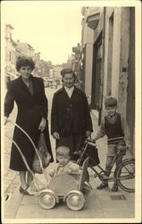 Woman and Chjldren with Stroller and Bike Postcard