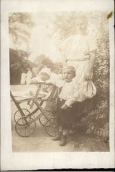 A Mother, Toddler, and Baby in a Buggy Postcard Postcard