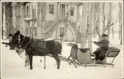 Horse-drawn sleigh in snow in front of mansion Horses Postcard Postcard