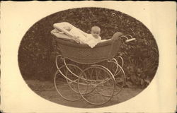 Portrait Photograph of Baby in Wicker Buggy Postcard