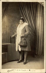 Black Woman in Fur-Trimmed Coat Postcard