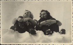 Two Women Sitting in the Snow Postcard