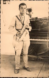 Man in Jodhpurs Holding a Saxophone Music Postcard Postcard