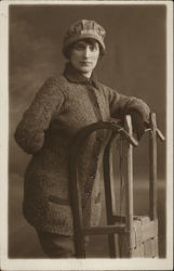 Woman in Winter Attire Posing with Sled Women Postcard Postcard