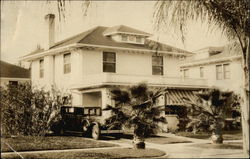 Photo of Home with Car in Front Buildings Postcard Postcard