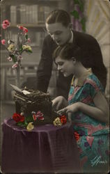 Couple at Flower Covered Typewriter Table Postcard