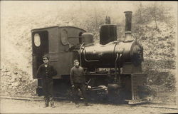 Two Men with Small Locomotive on Train Track Postcard