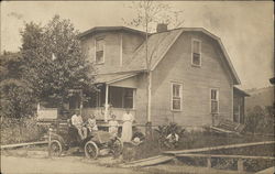 House with Family and Automobile in the Front Cars Postcard Postcard