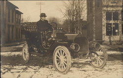 Man Sitting in Old-Fashioned Car Cars Postcard Postcard