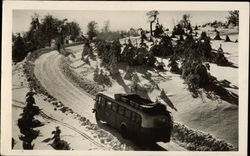 Bus Traveling up Snow-covered Road Postcard