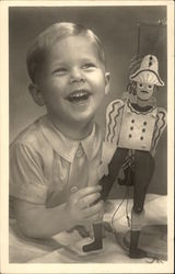 Young Blonde Boy Laughing with his Toy Boys Postcard Postcard