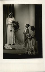 Bride holding Bouquet with Young Attendants Postcard