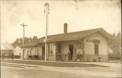 Four Men Waiting outside Union Railroad Depot Postcard