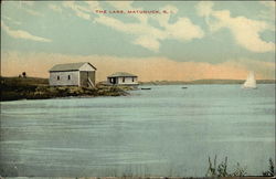 "The Lake" - View of Water, Two Cottages, and Sailboat Postcard