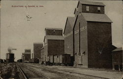 Grain Elevators near Railroad Tracks Postcard