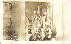 USS Texas Sailors Posing at Prison Gate Entrance Navy Postcard Postcard