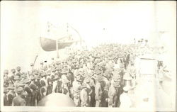 Crowd of men stand on a ship dock Postcard