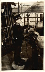 Boy in Uniform at Helm of Baot Postcard