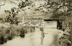 Baby in the Creek Near a Bridge Babies Postcard Postcard