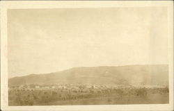 Distant View of a Desert Town Landscapes Postcard Postcard