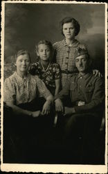 German Soldier with Wife and Daughters Postcard