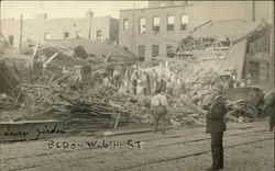 Cleaning up the Tornado Wreckage - Building on W. 6th Street Postcard