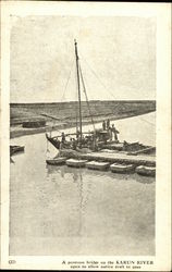 A pontoon bridge on the Karun River open to allow native craft to pass Riverboats Postcard Postcard