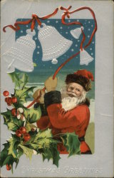 Santa holding red ribbon with bells and holly on the ribbon Postcard