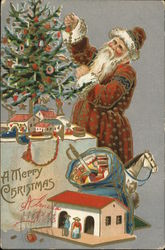 Santa decorating tree on table Santa Claus Postcard Postcard