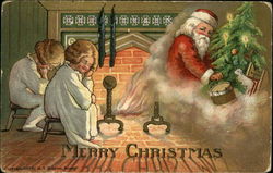 Two kids in front of fireplace Santa in smoke with tree and toys Postcard