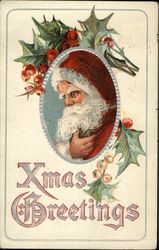 Picture of Santa in middle with holly around picture Postcard