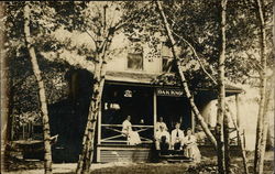 "Oak Knoll" People on Cabin Porch in Trees Postcard