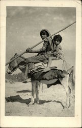 Two Children on Donkey Postcard