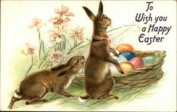 Bunnies with a basket of Easter eggs Postcard