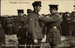 Decorating a Canadian on the Field of Battle Postcard